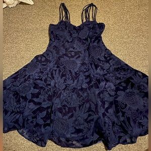 Jump apparel co. dark blue w floral pattern and sparkles. zip up back.